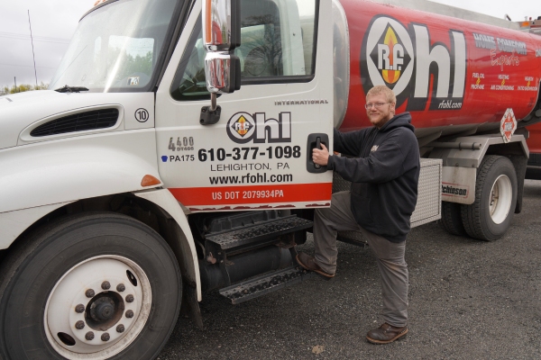 R.F. Ohl expert technician standing in front of oil delivery truck